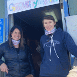 Two CRW employees standing outside a community clubhouse